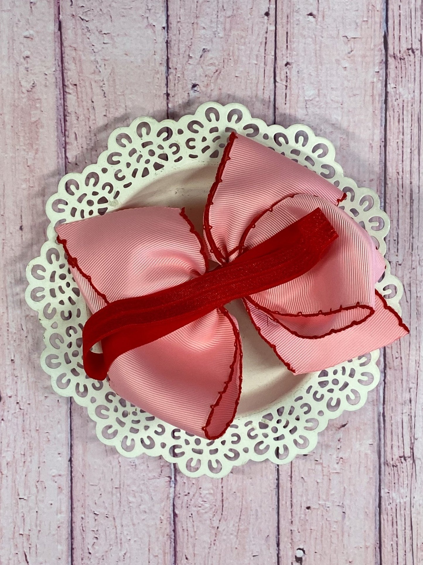Back of Pink Apple Moonstitch Bow Headband showing satin elastic band