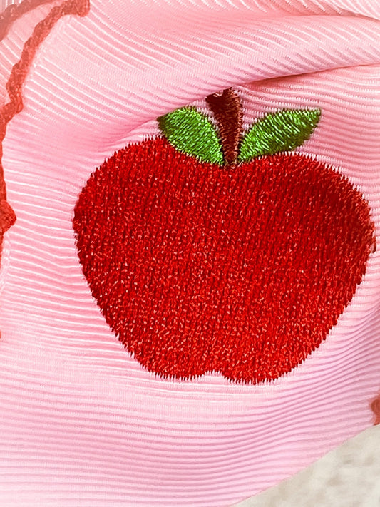 Close up of pink apple embroidery on moonstitch hair bow - Alternative view