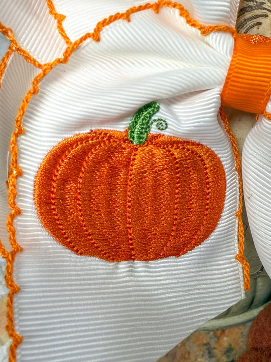 Close-up of pumpkin embroidery detail on hair bow - Alternative view