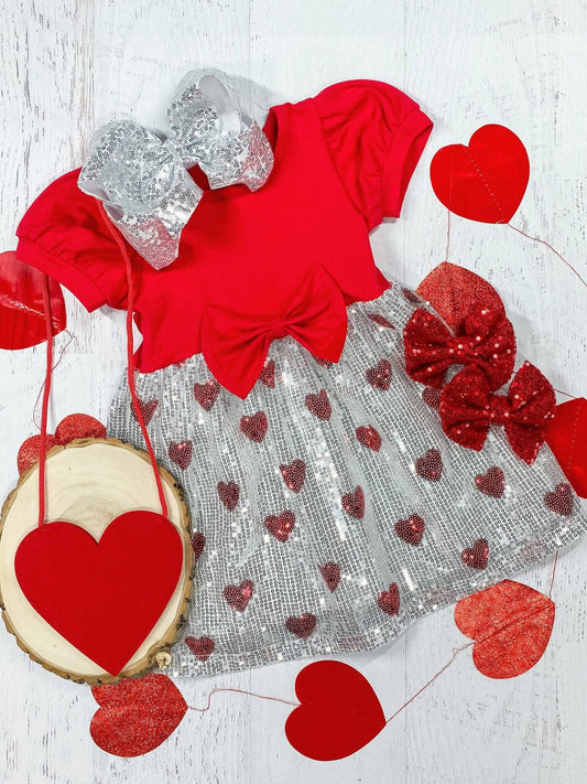 Red top with silver sequin bottom dress with red sequin hearts and a bow at the waistline. - Alternative view