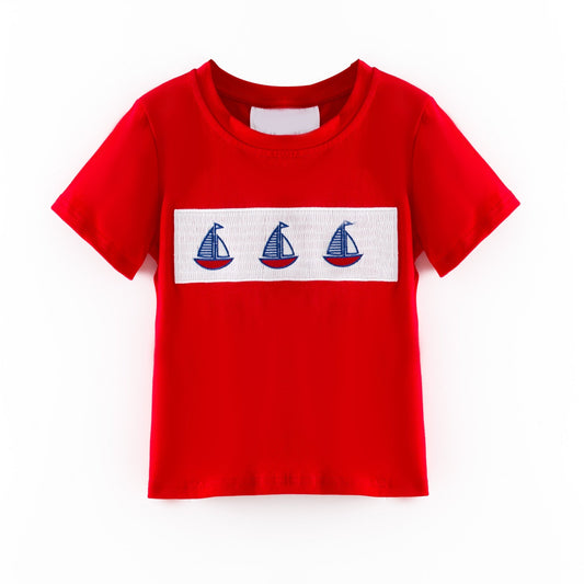 Red t-shirt with a white stripe featuring three blue sailboat graphics on a white background - Alternative view