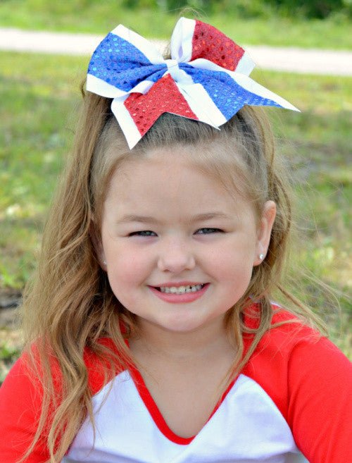 Red, white, and blue sequin cheer bow for girls on model - Alternative view