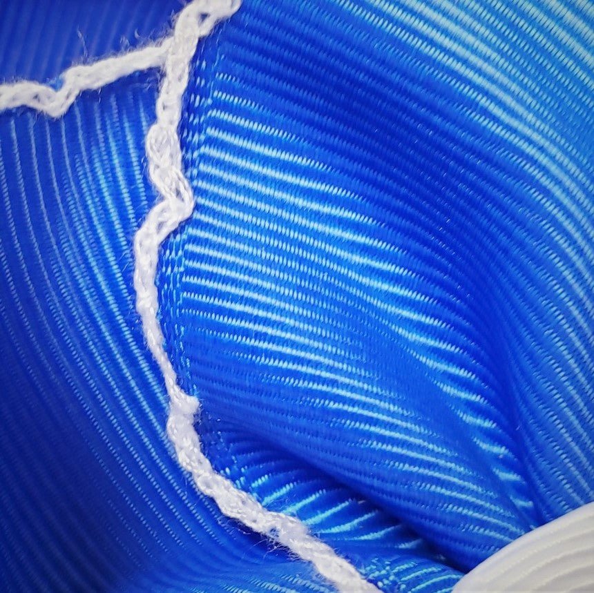 Close-up of blue and white rope with a textured pattern