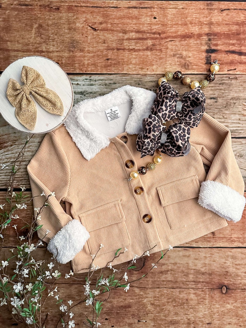 Tan jacket. Accessories not included.