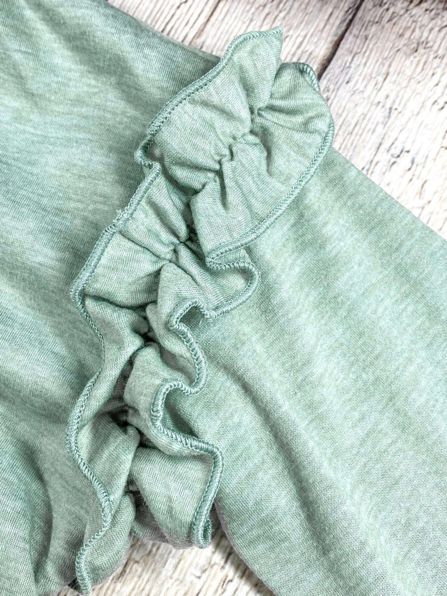 close up of the ruffles on the sleeve/top of shoulder