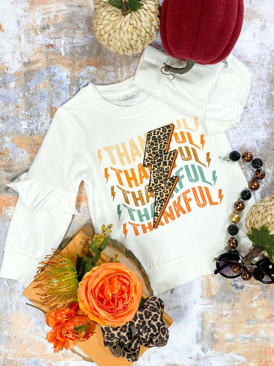 Long sleeve ruffle top with a lightning bolt Thankful design - Alternative view