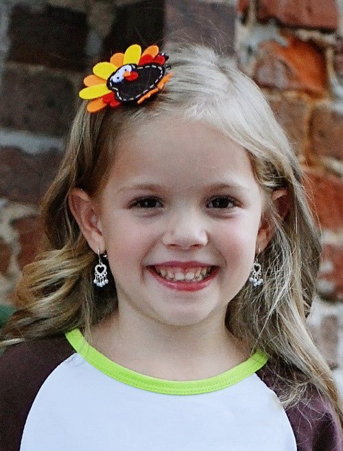 Girl wearing a Thanksgiving felt turkey clippie - Alternative view
