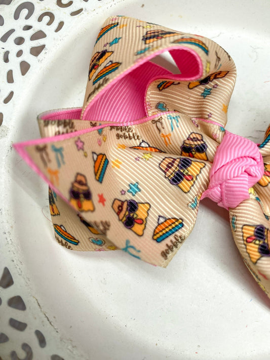 close up of the fun print over an oatmeal background with funky turkeys and pies and stars - Alternative view