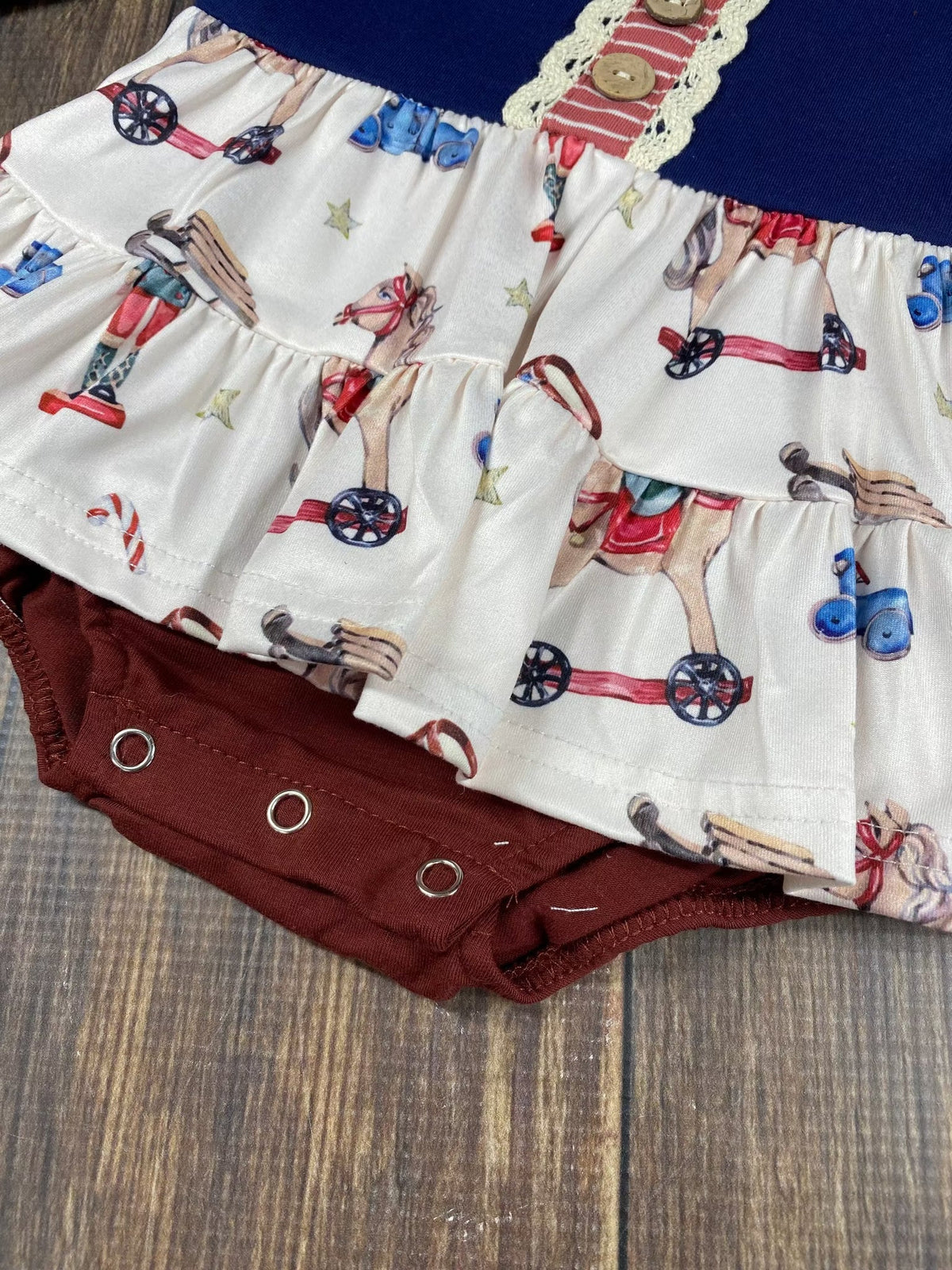 Vintage Christmas toys baby romper with a ruffle skirt