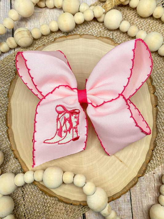 Pink Western Boot Embroidered Moonstitch Hair Bow on a wooden background - Alternative view