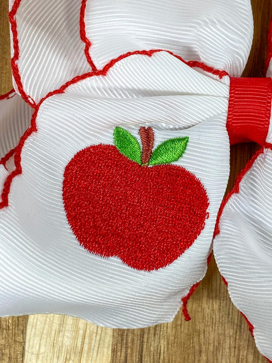Close up of white apple embroidery on moonstitch hair bow - Alternative view