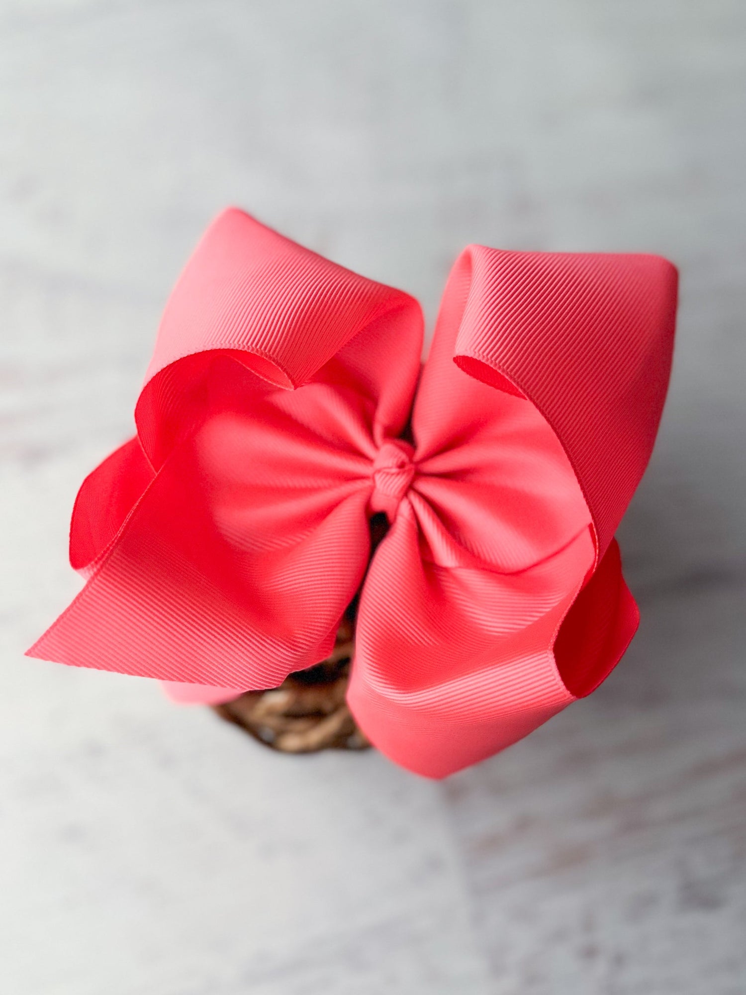 big hair bow in pink size 6-7"  on decorative background