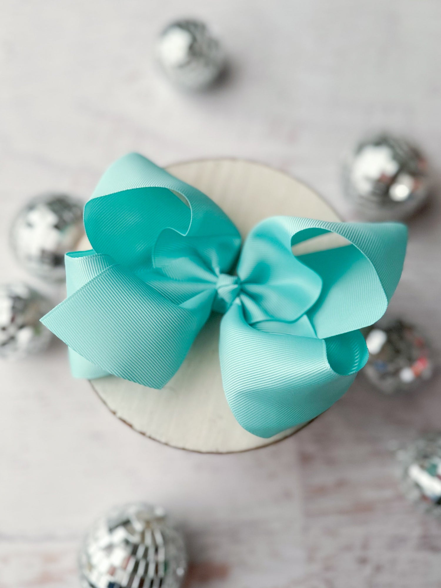 4-5" bows - aqua bow shown on decorative background
