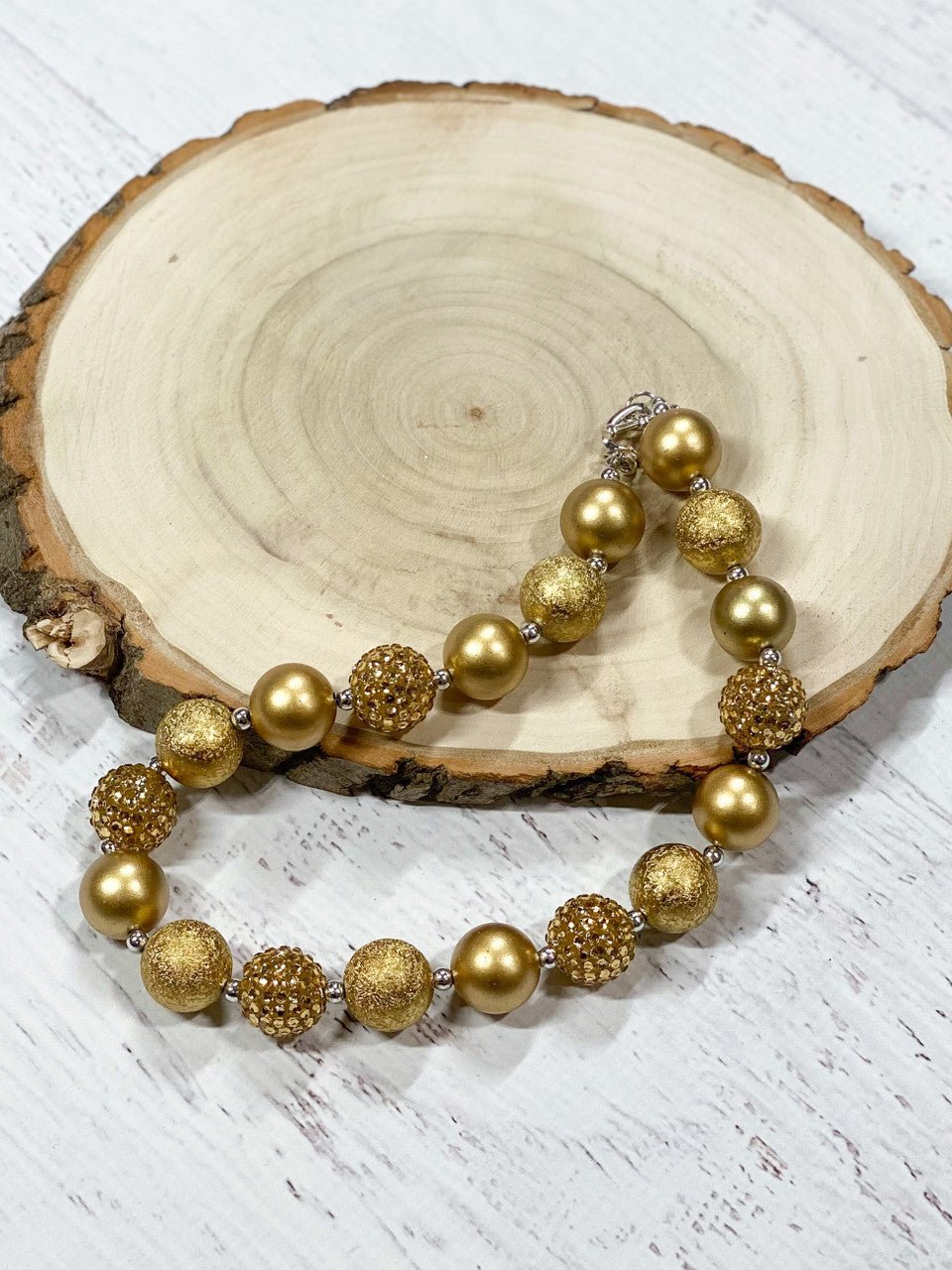 gold necklace  on decorative background
