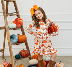 Outfits for Girls - girl posing with pumpkin