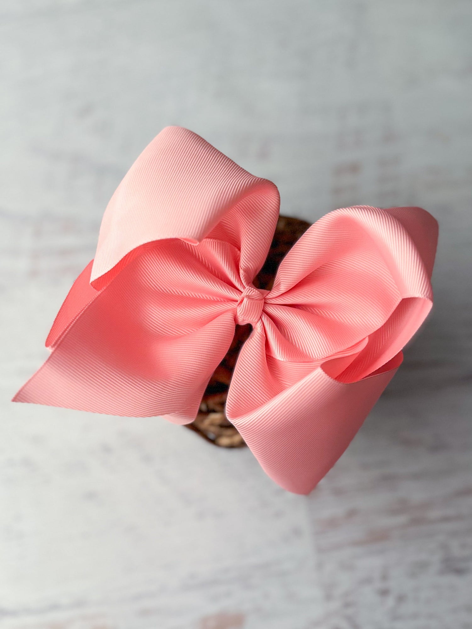 pink hair bow - 5-6" on decorative background