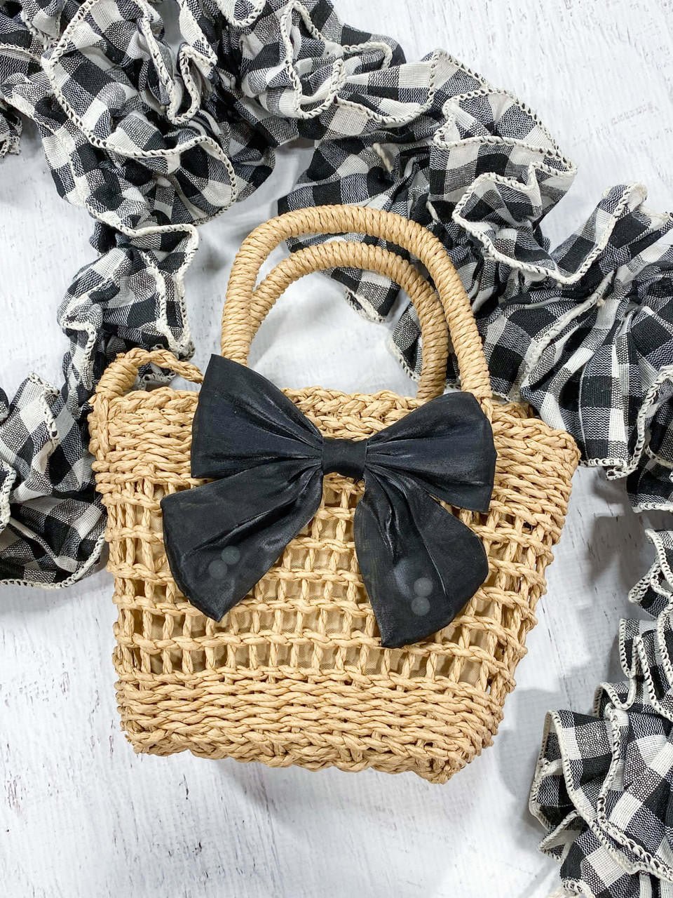 straw purse  on decorative background