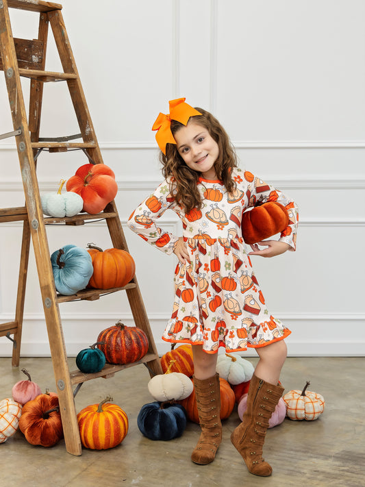 Model wearing the Thanksgiving Treats Twirl Dress