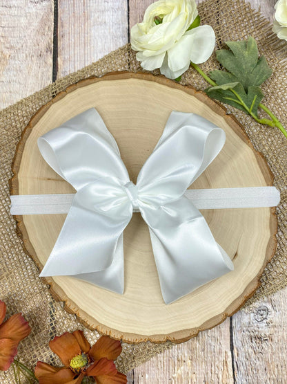 satin white headband on a wooden background