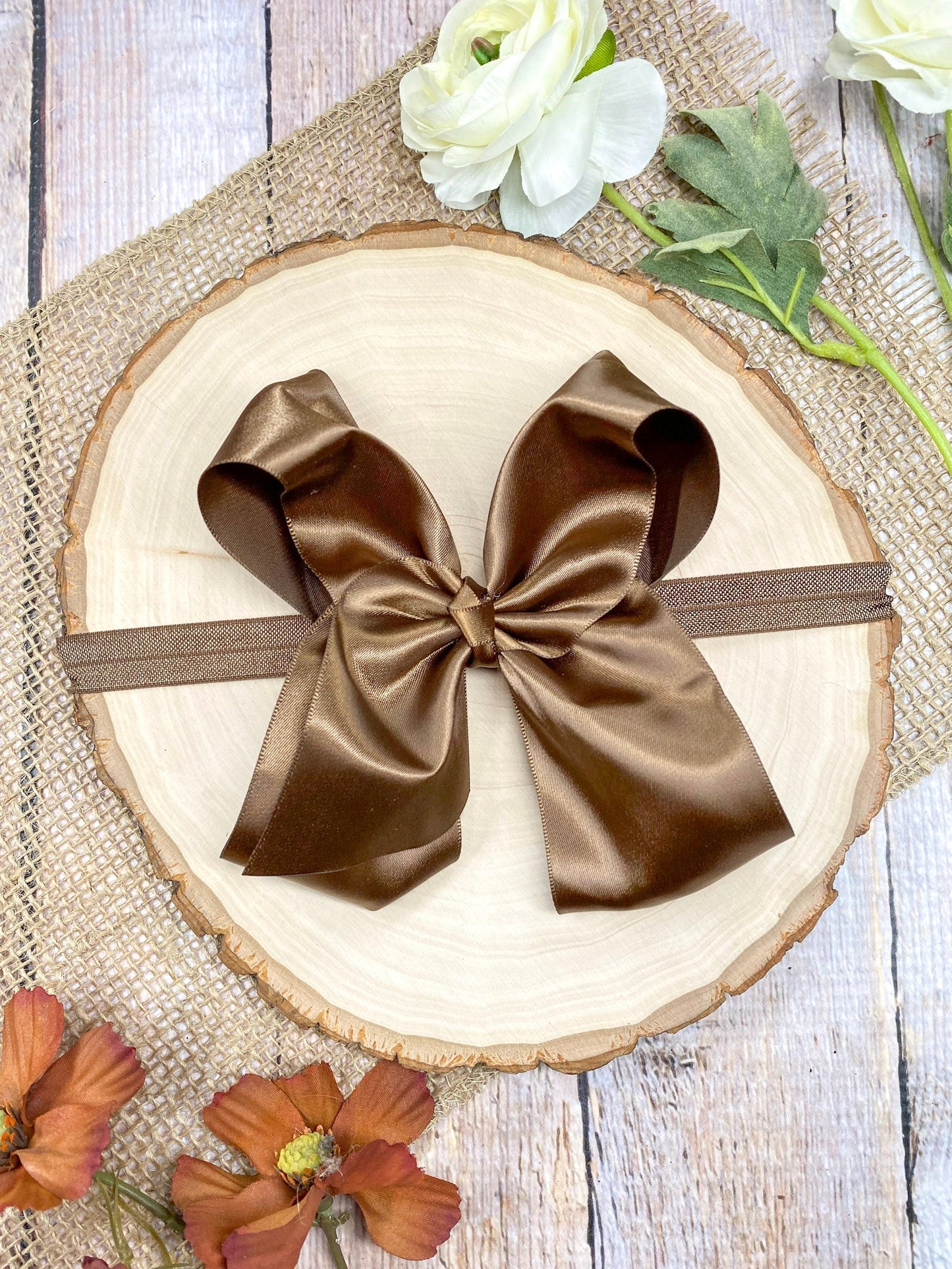 satin brown headband on a wooden background