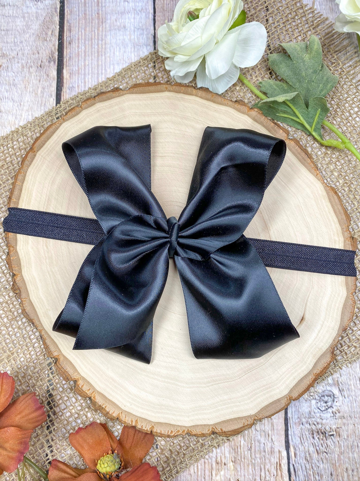 satin black headband on a wooden background