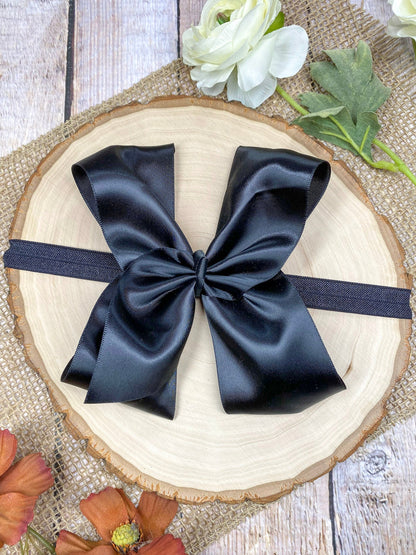 satin black headband on a wooden background