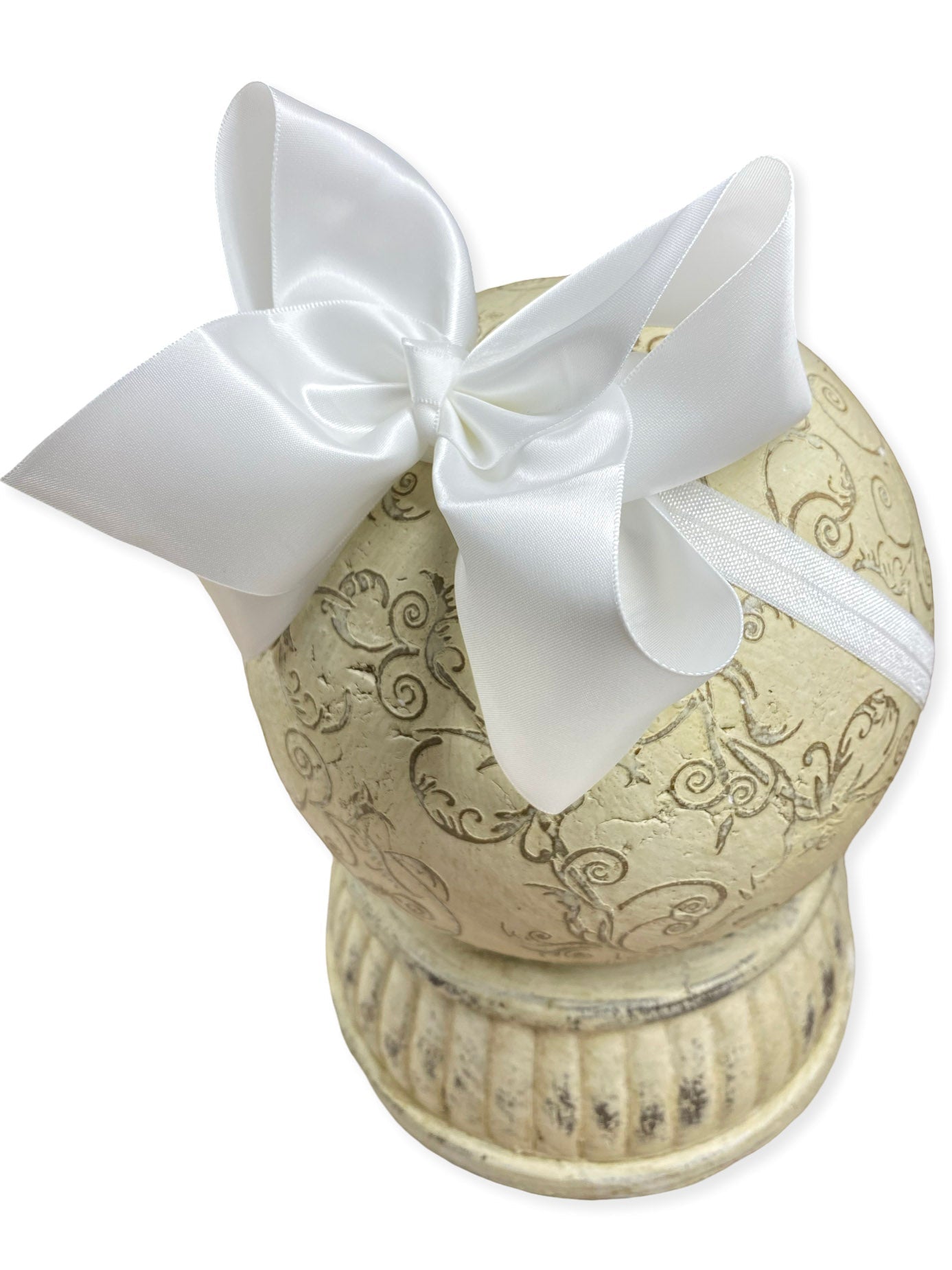 white satin ribbon bow on headband a white background