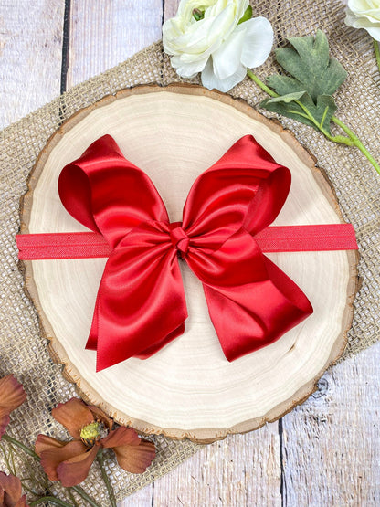 satin red headband on a wooden background