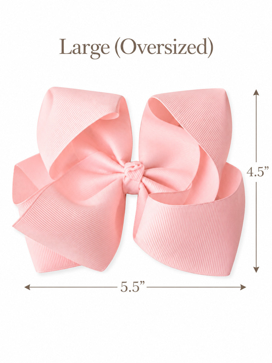 Size guide for our 5.5 inch oversize grosgrain hair bow with measurements