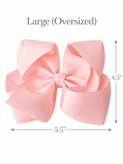 Size guide for our 5.5 inch oversize grosgrain hair bow with measurements