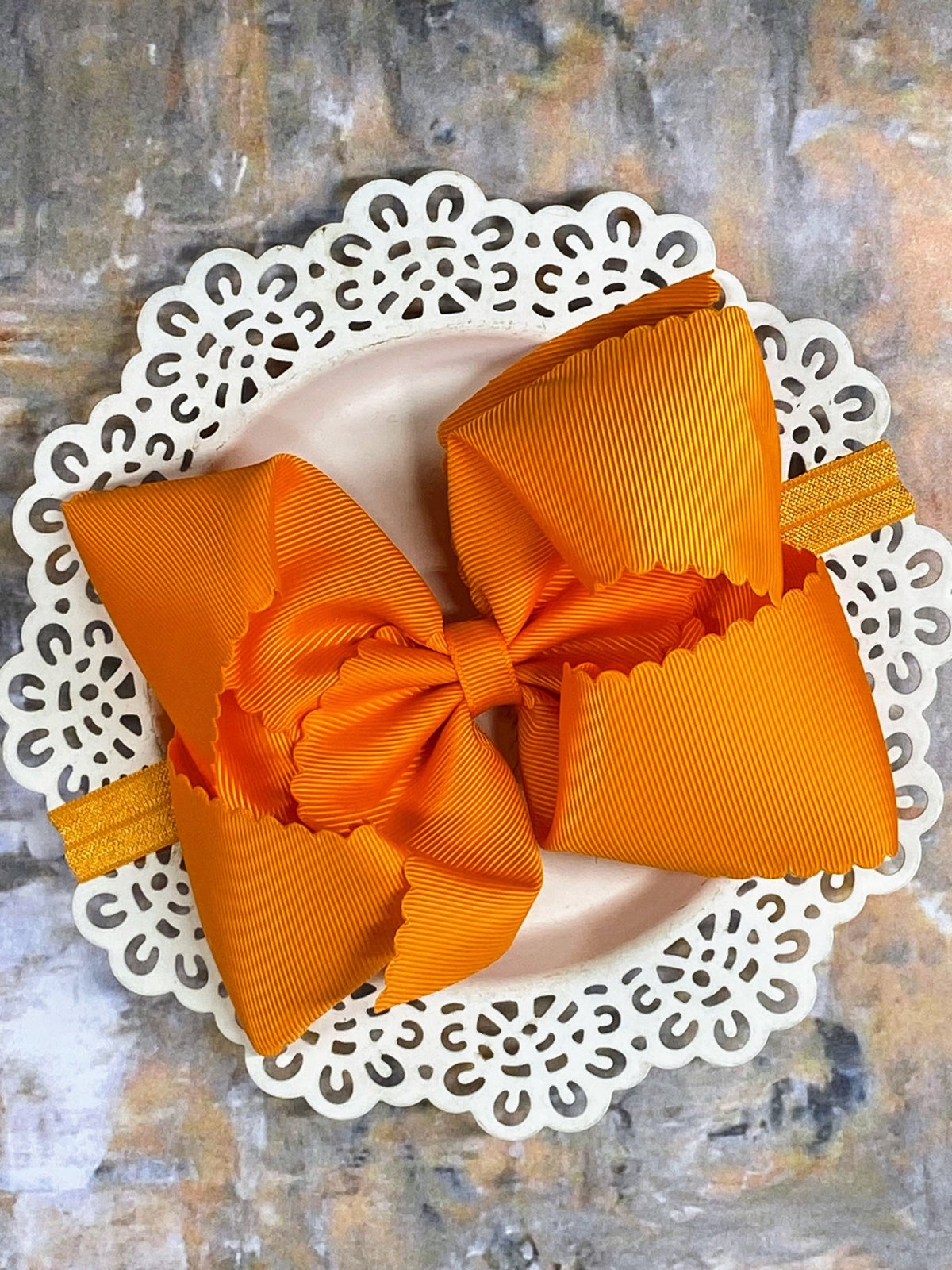 5.5 inch orange oversize scalloped hair bow on satin headband