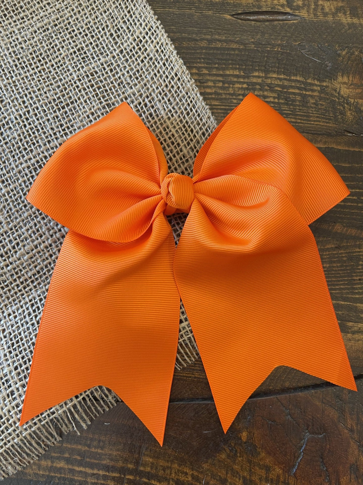 6 inch dark orange solid cheer bow on alligator clip