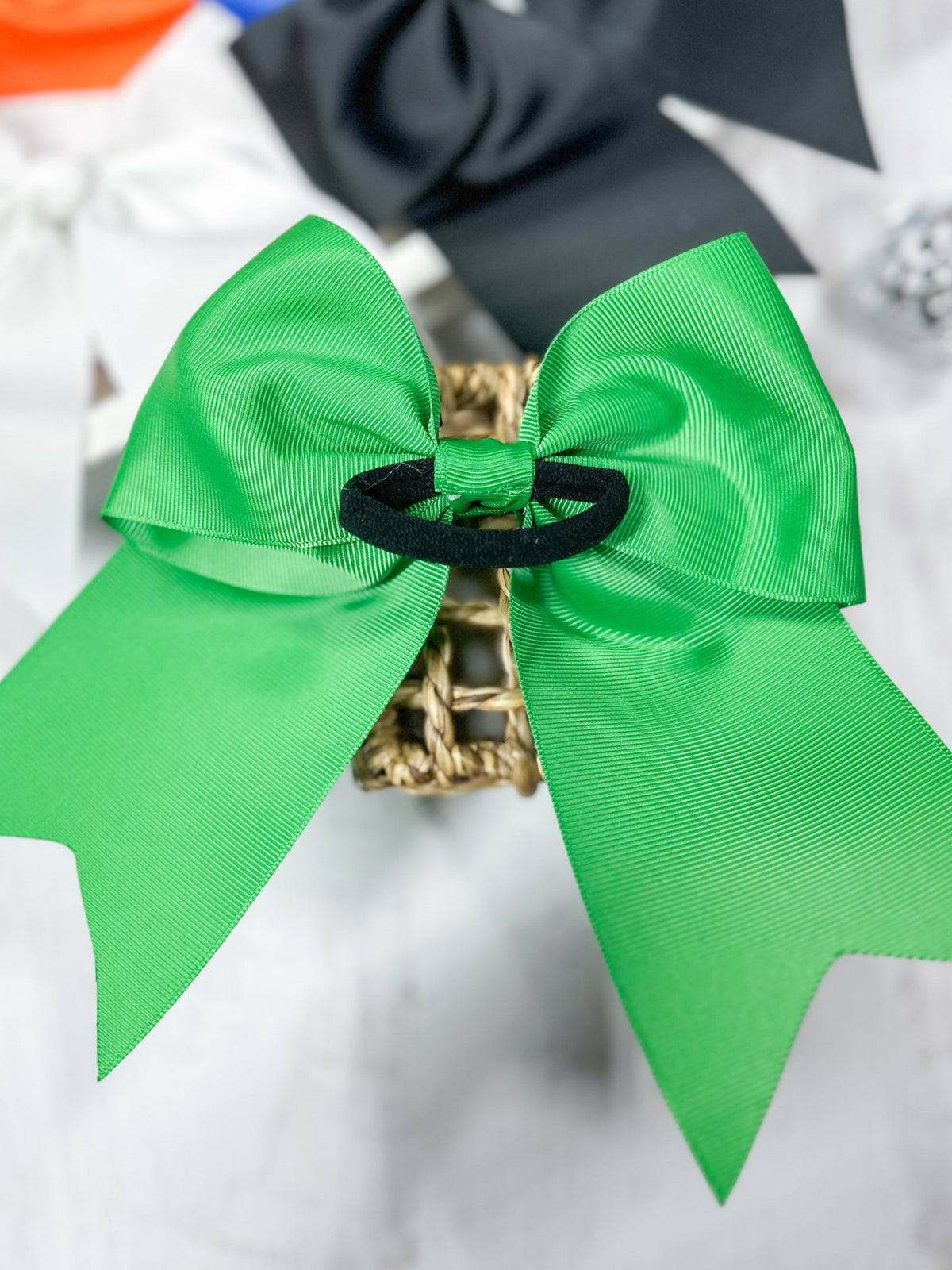Back of 6 inch solid cheer bow showing pony-o elastic