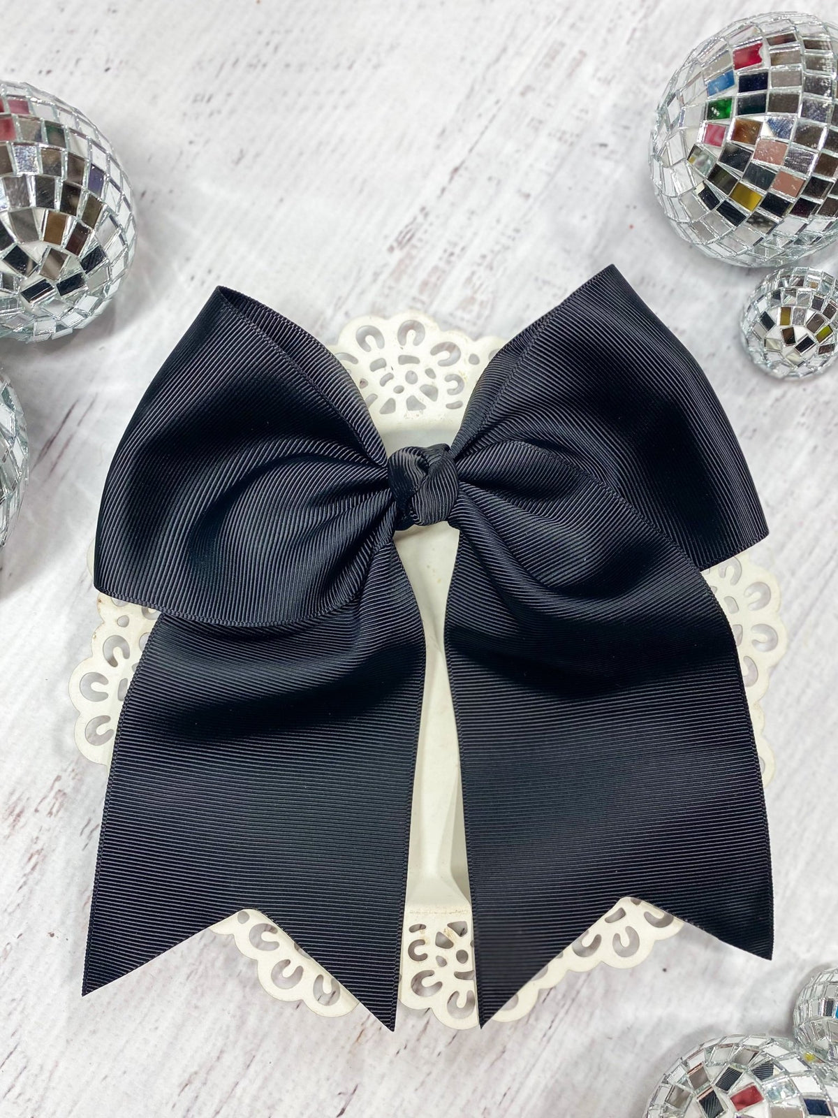 6 inch black solid cheer bow on pony-o