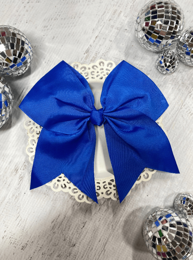 6 inch royal blue solid cheer bow on pony-o