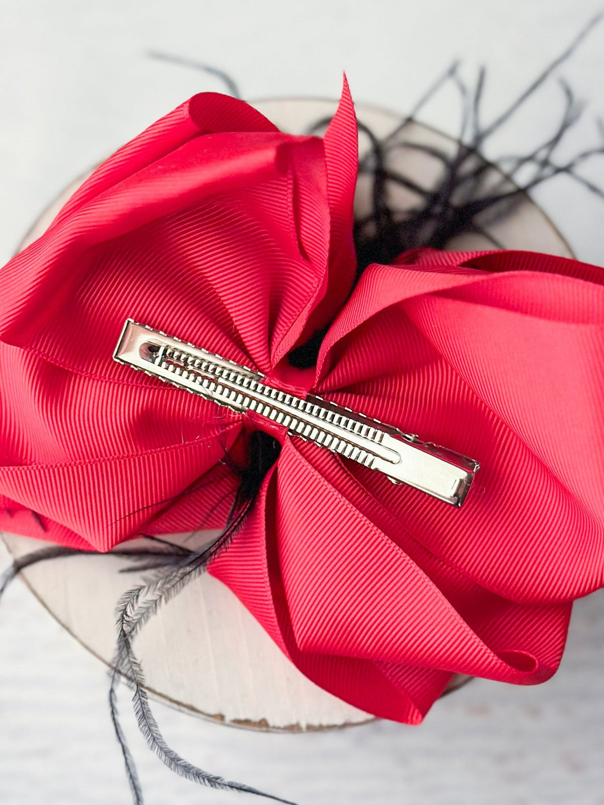 Back of 6 inch two-tone feather puff hair bow showing alligator clip