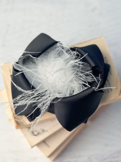 6 inch black grosgrain hair bow with white feather puff