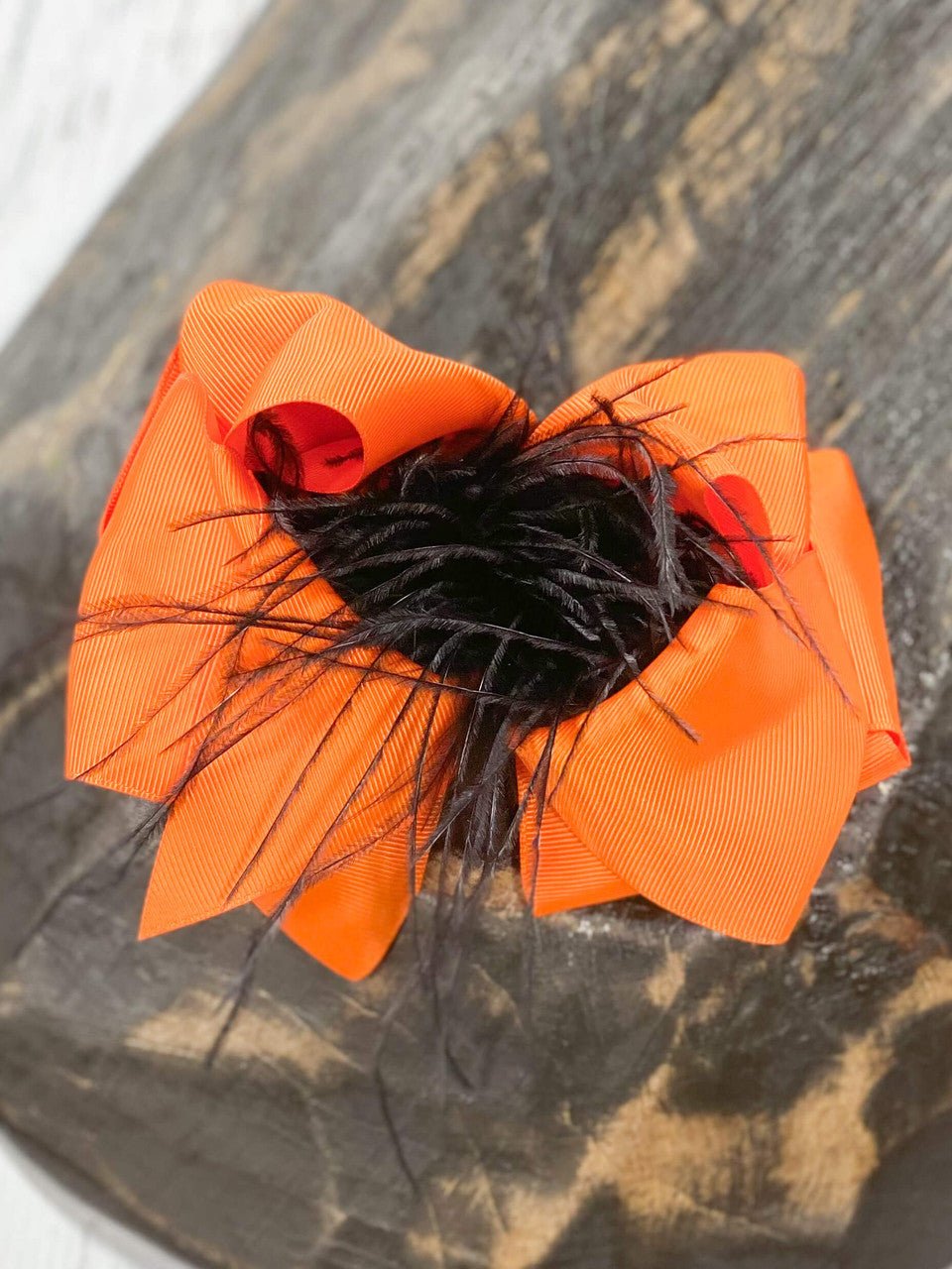 6 inch orange grosgrain hair bow with black feather puff
