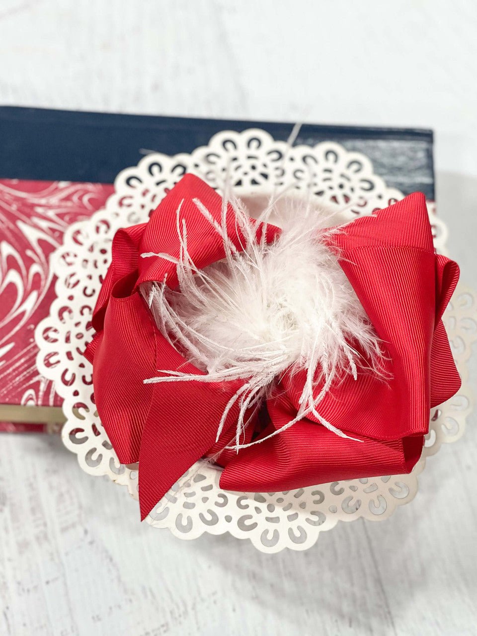 6 inch red grosgrain hair bow with white feather puff