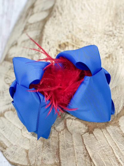 6 inch royal blue grosgrain hair bow with red feather puff
