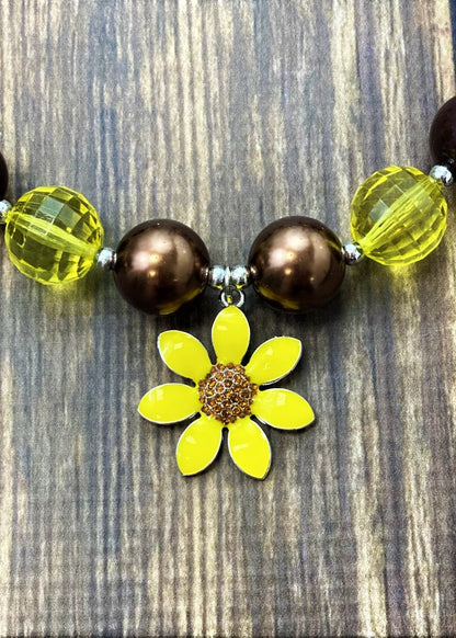 Sunflower pendant with rhinestone center.