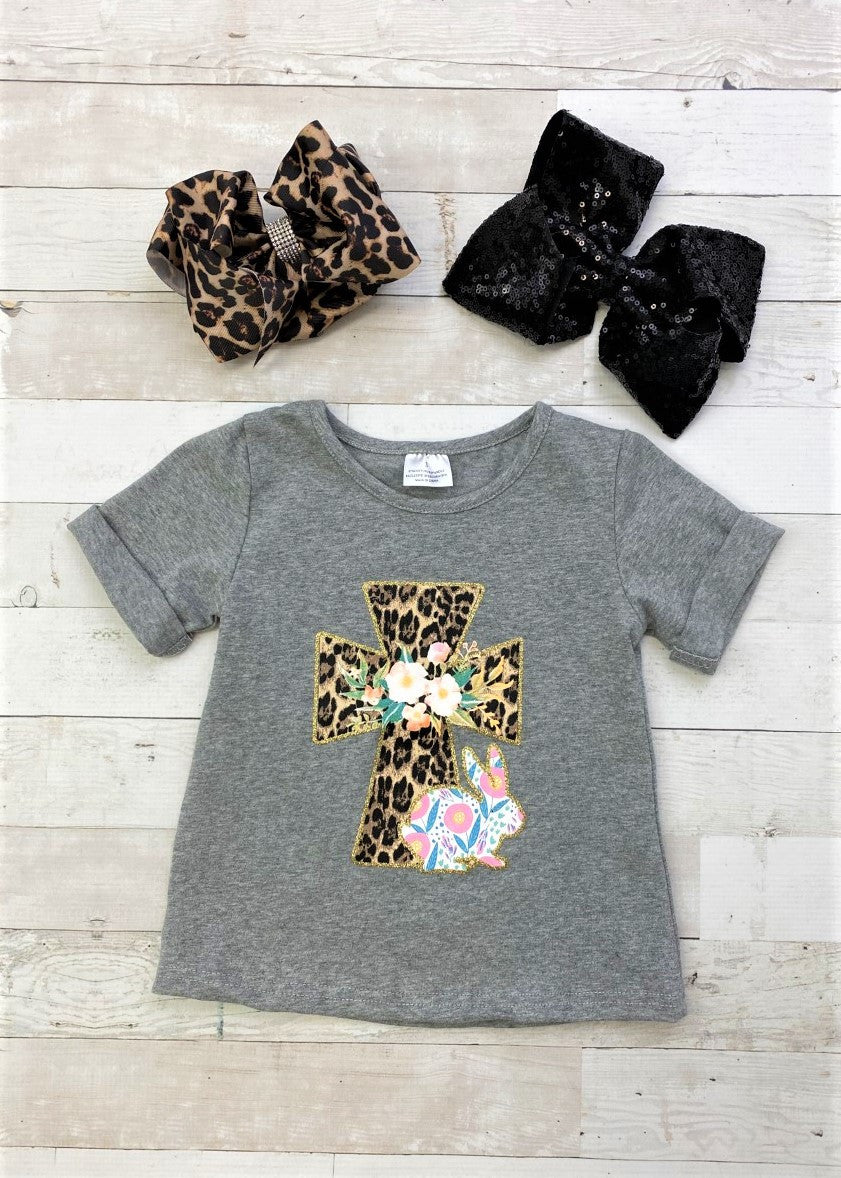 Heather grey t-shirt with rolled cuffs and a gold glitter bordered animal print cross and floral bunny. 