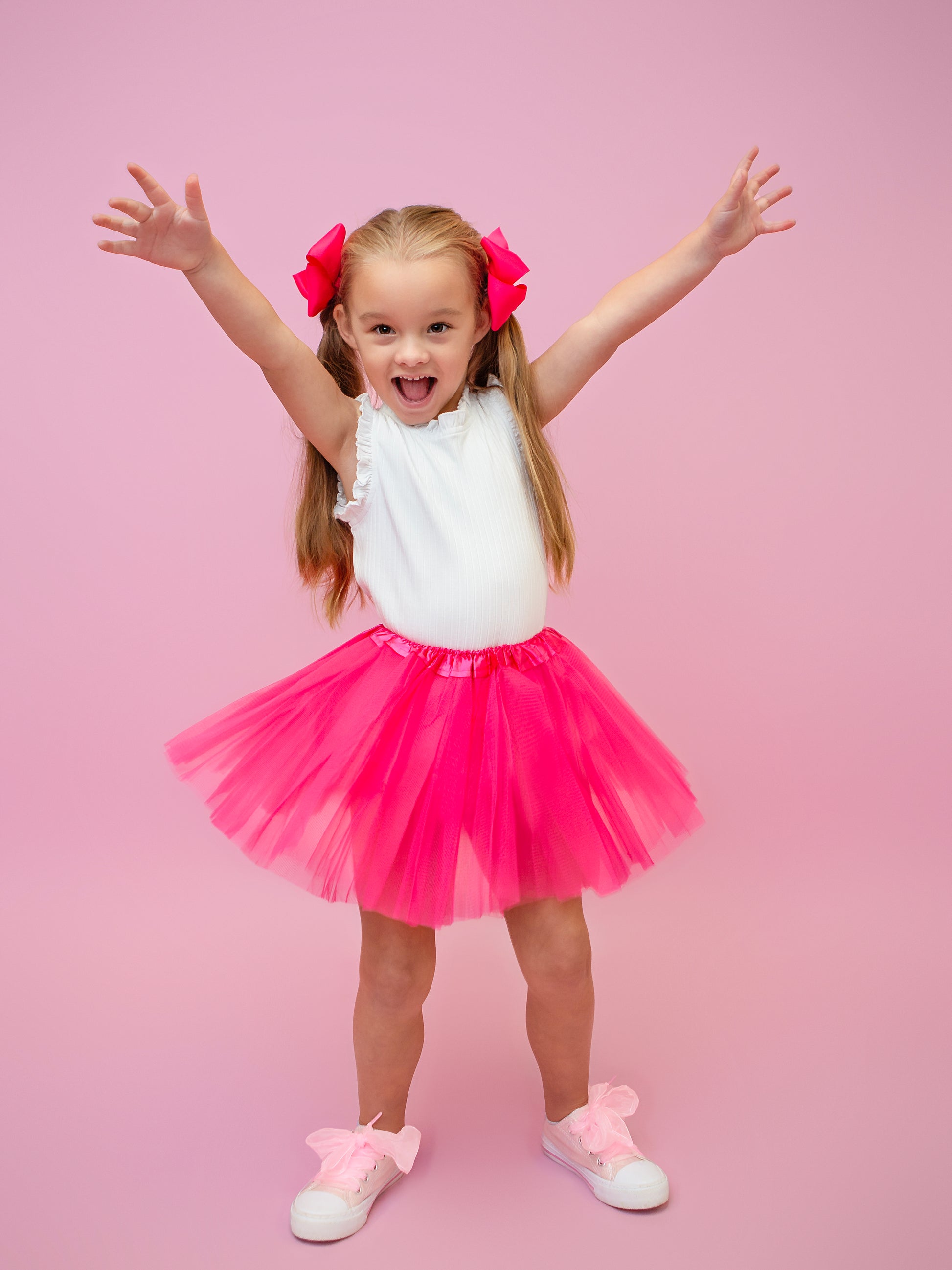 Hot pink tutu shown on model.