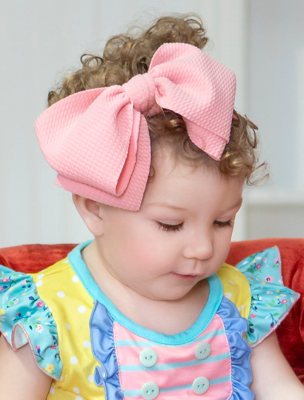 Fabric headband shown on infant.
