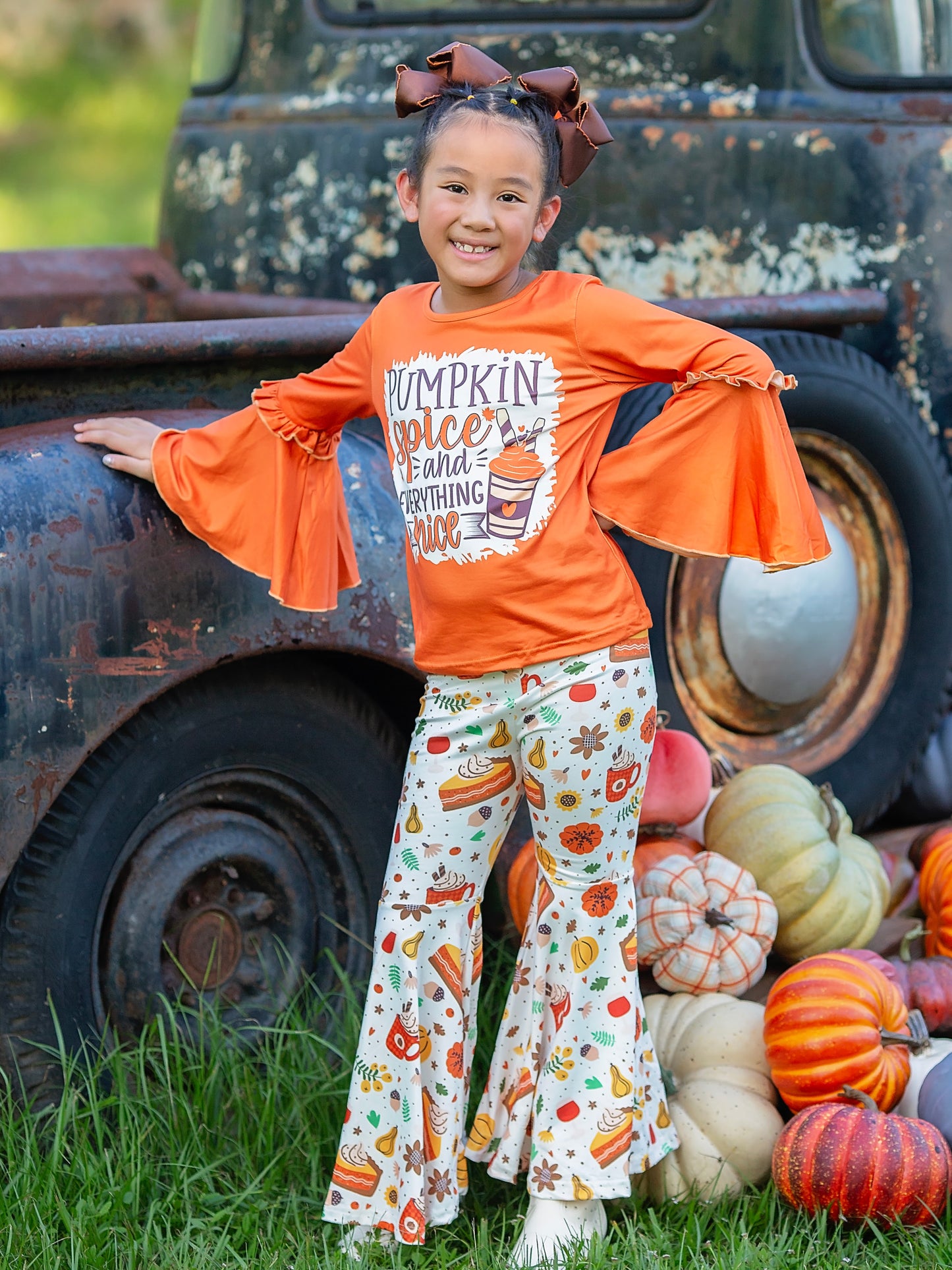 pumpkin spice and everything nice top and bell bottoms set on a model