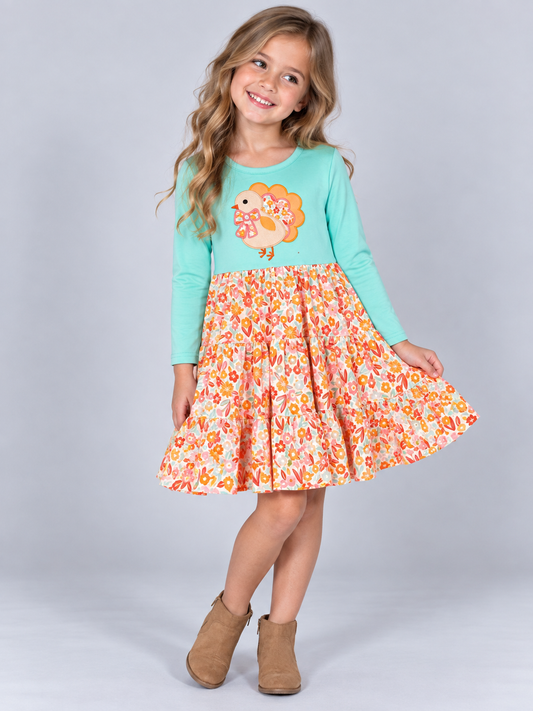 Thanksgiving turkey appliqué girls dress with aqua top and floral tiered skirt on model