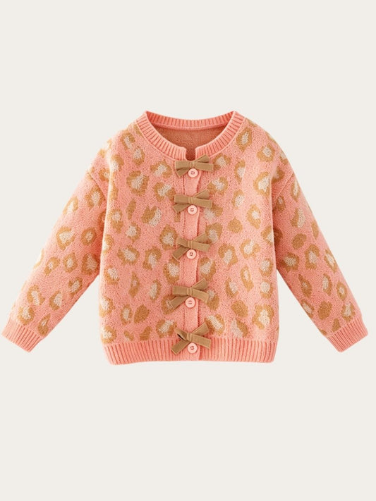 Girls pink leopard print knit cardigan with brown bow accents and buttons