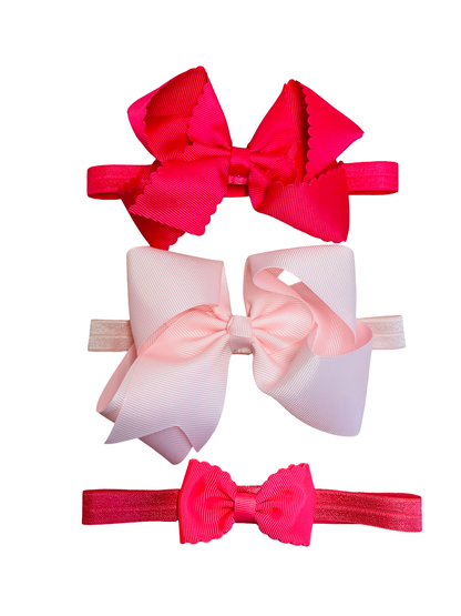 Three colorful hair bows on white background