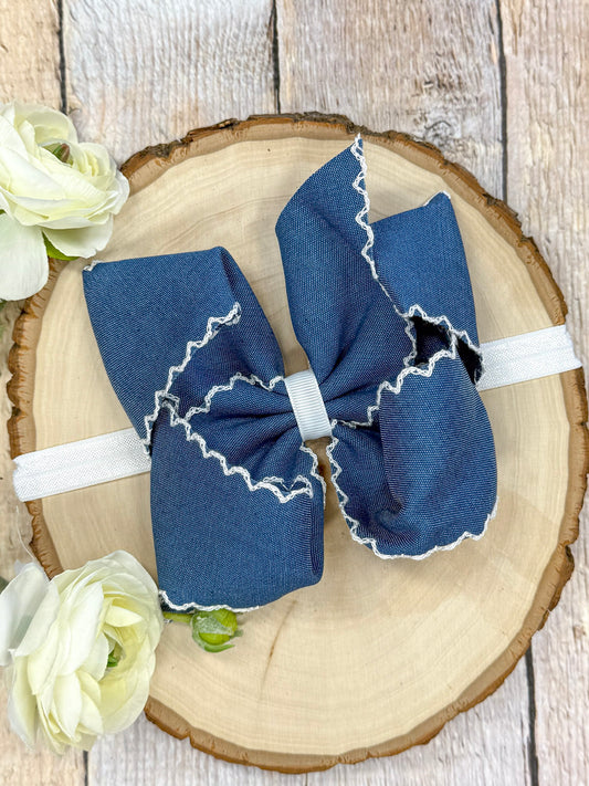 Denim blue moonstitch headband with white stitched trim on soft nylon band