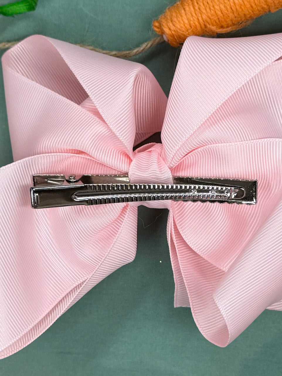 Clip on back of hair bow